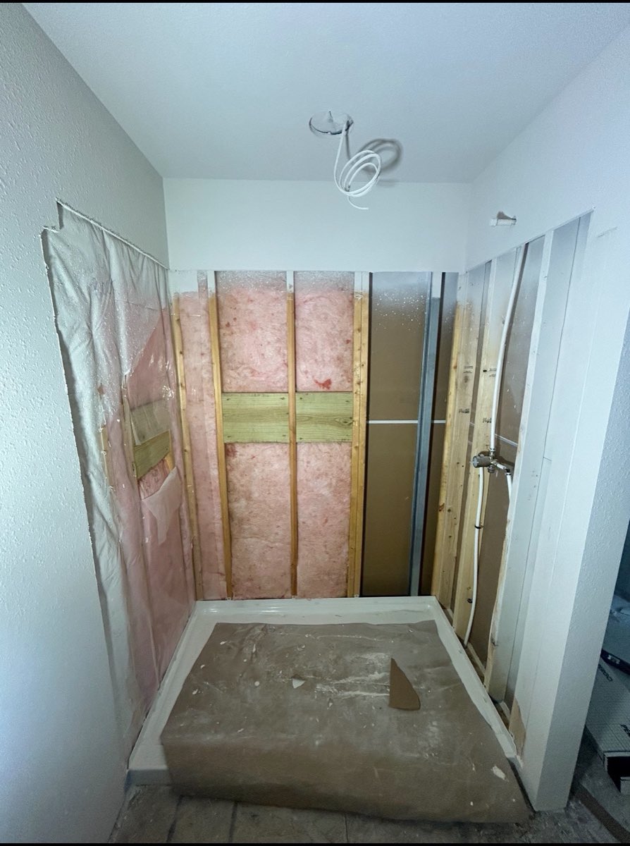 Bathroom shower rebuilt to the studs with new framing, insulation and a fresh shower pan